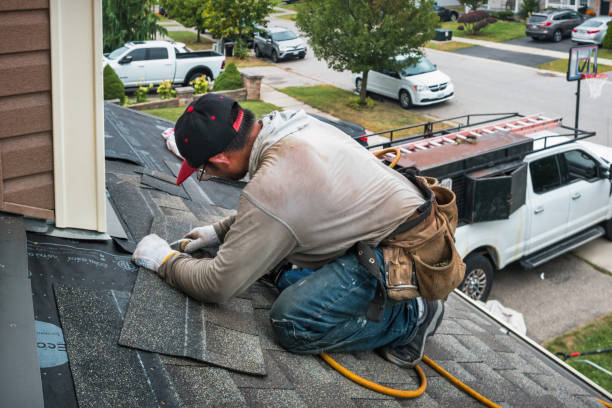 Professional Roofing technician working in Roland, OK
